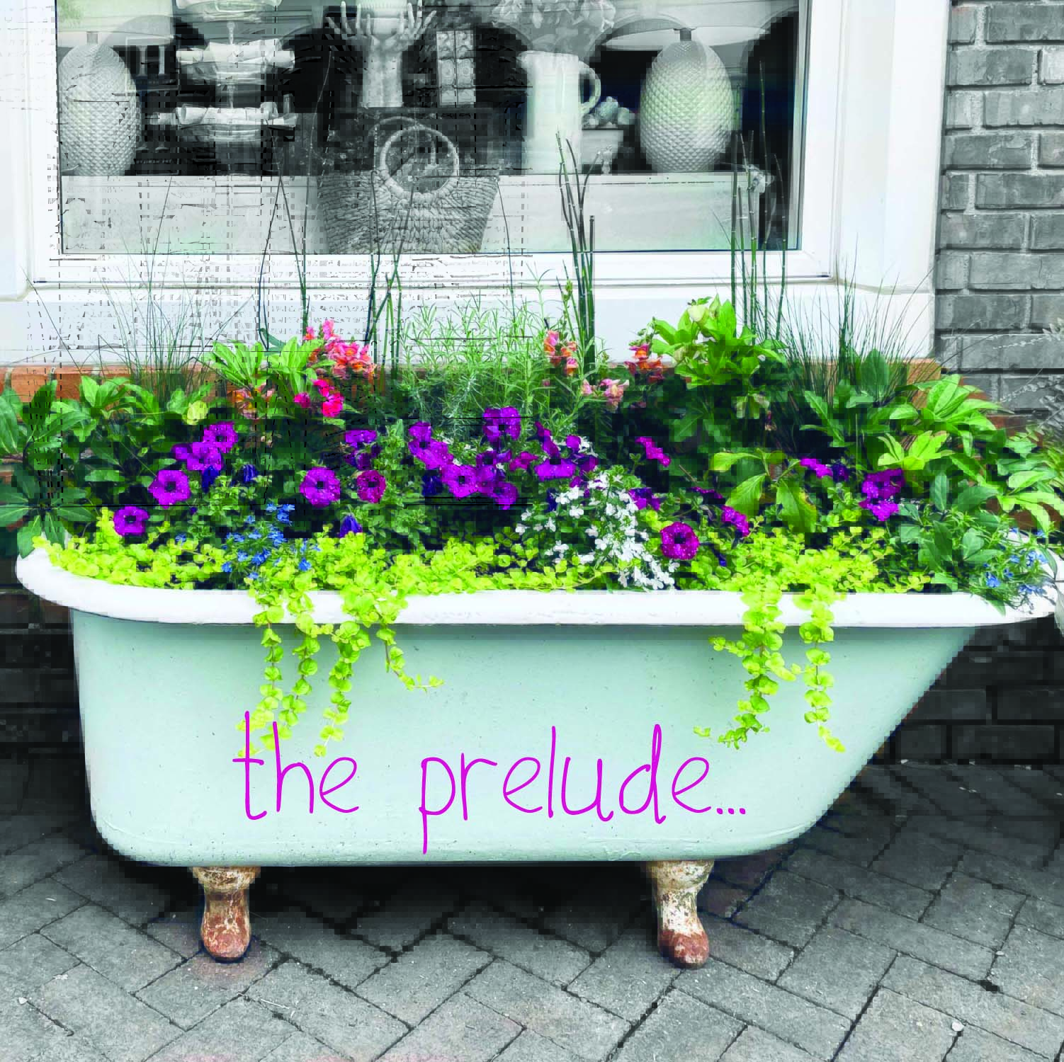 Clawfoot tub art installation filled with vibrant spring flower arrangement.
